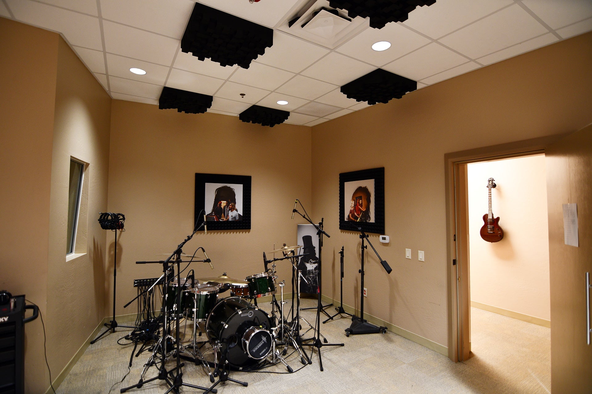 Black acoustic foam wedge panels arranged on studio wall