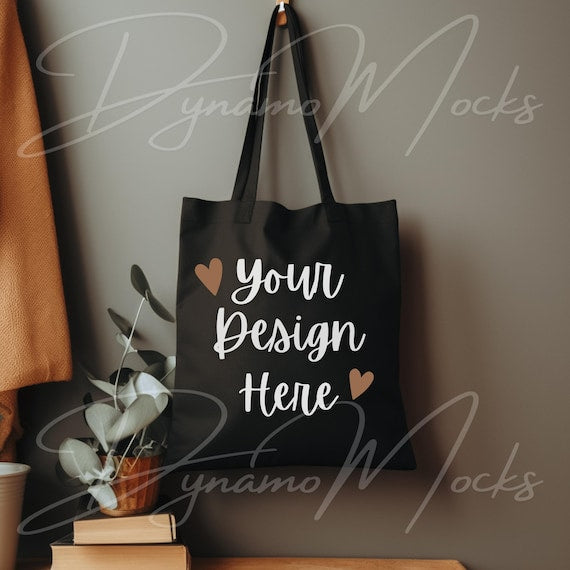Minimal black canvas tote bag on neutral background